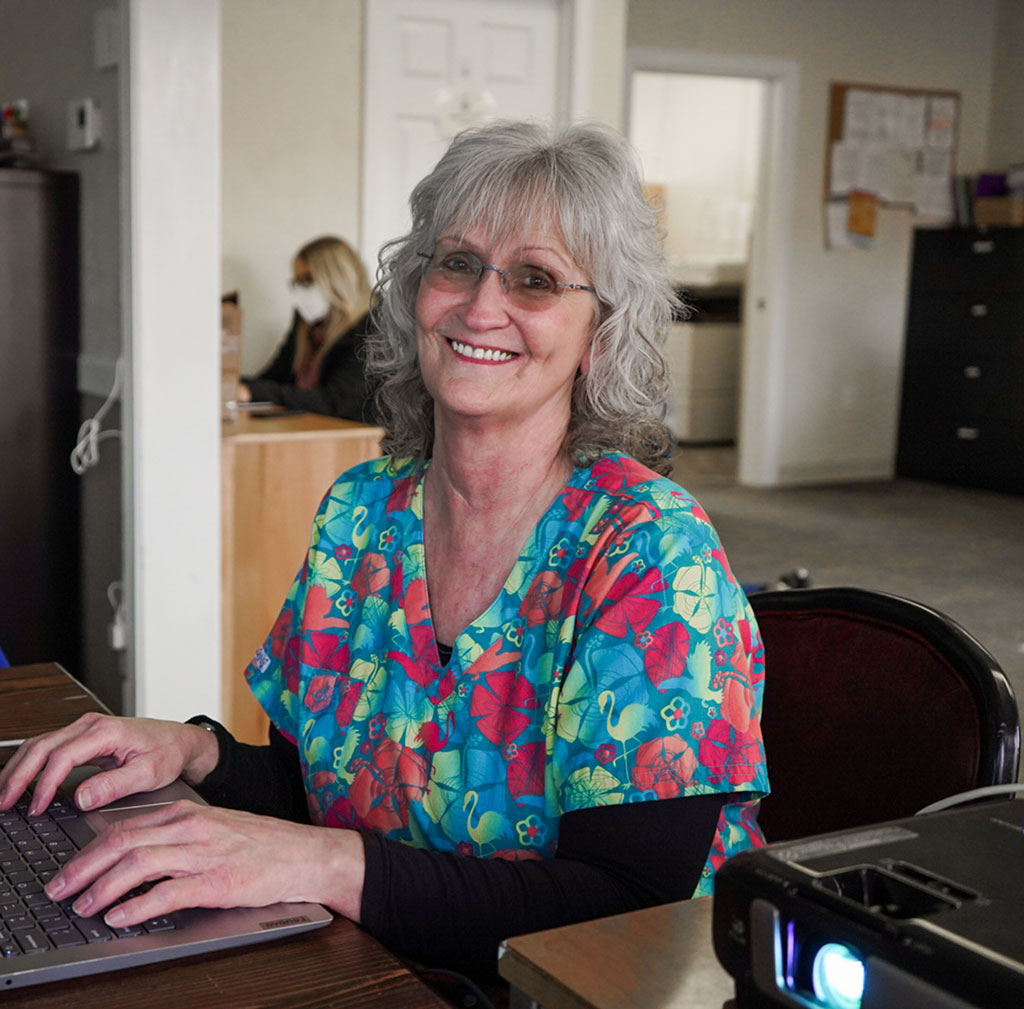WellSpring Home Health employee works at her desk.