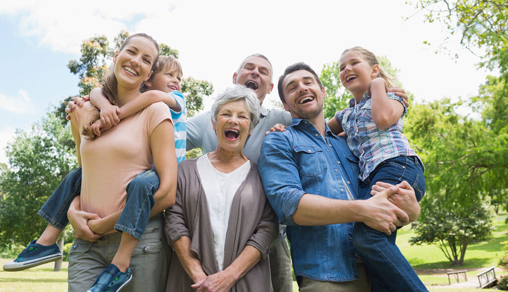 Multi-generational family enjoys time together outside.